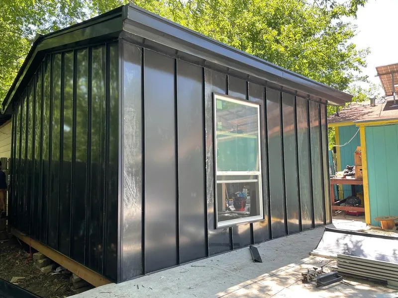 Black standing seam metal wall panels for Metal Roof Installation in Mineola