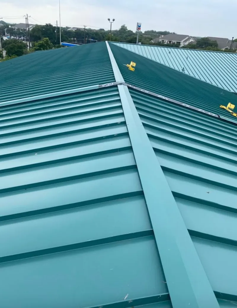Green commercial metal roof ridge and valley for Metal Roof Repair in Mineola